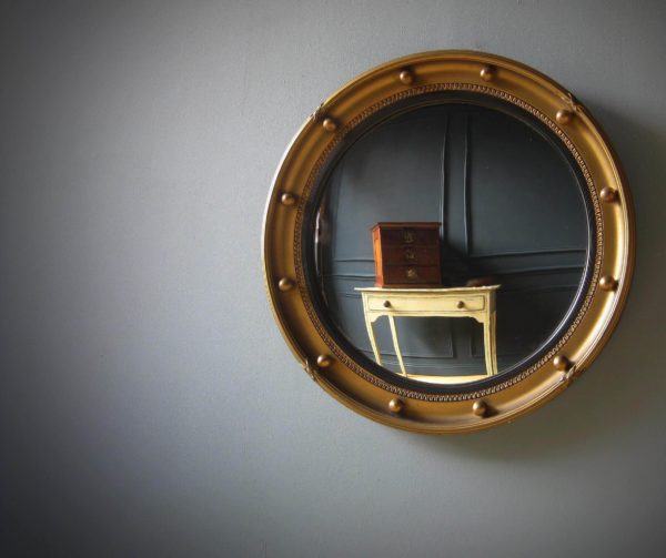 Antique convex gilt mirror